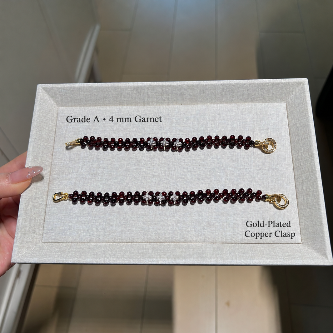 4 mm garnet woven bracelet and gold-plated copper clasp details