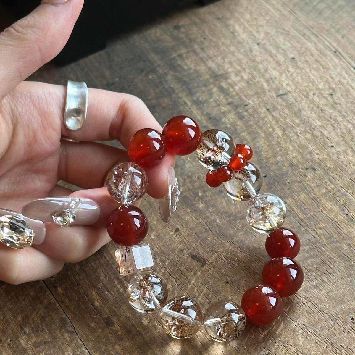Red agate and golden-inclusion crystal bracelet – actual product photo 1
