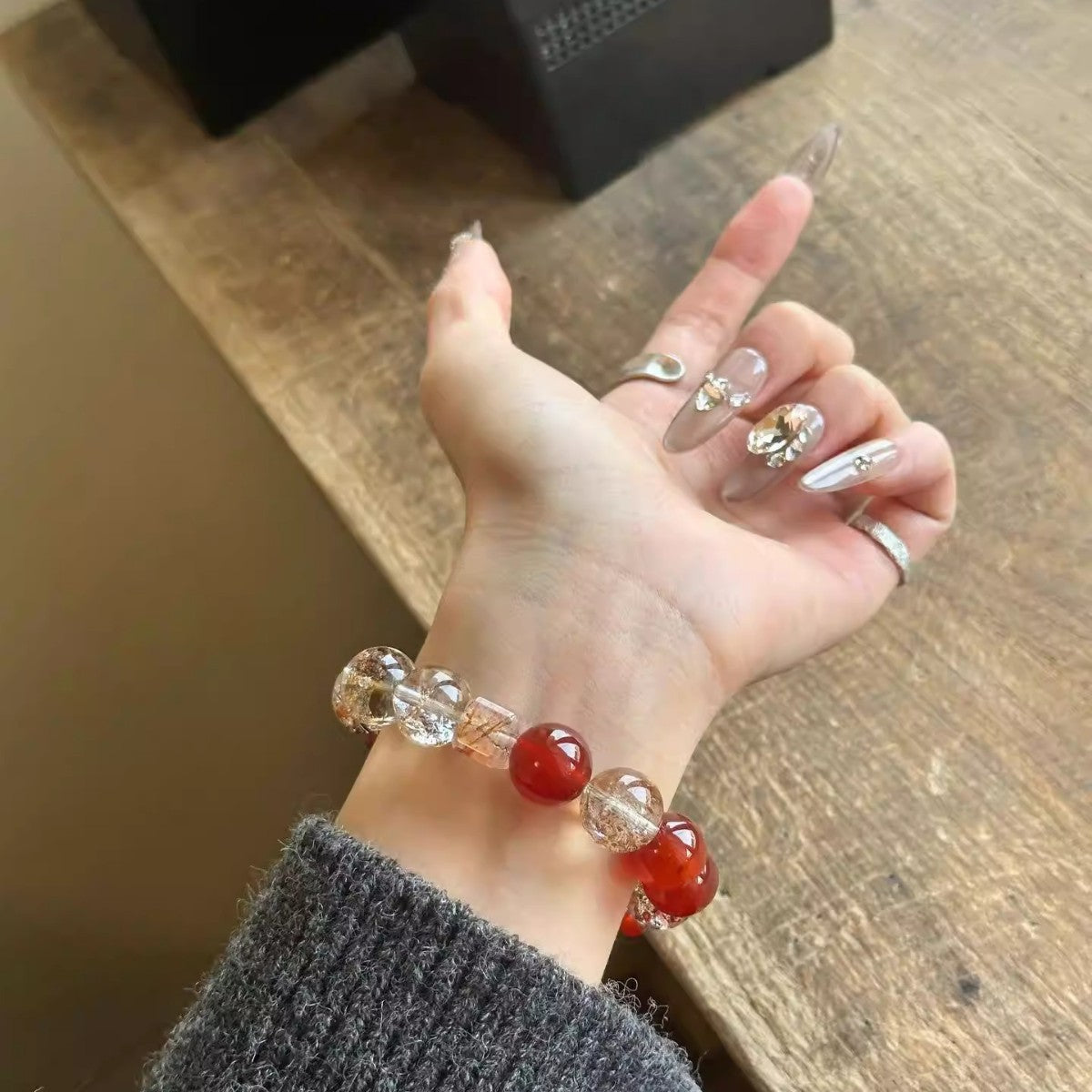 Red agate and golden-inclusion crystal bracelet – actual product photo 3