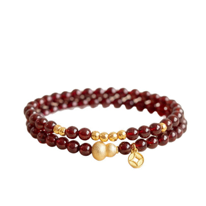 Original white-background garnet double-wrap bracelet with gold-colored accents