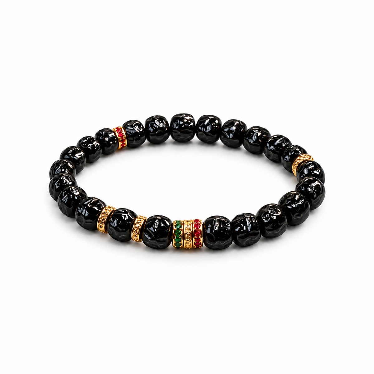 Sculpted black coconut pedicel bracelet with gold-tone and colored accents on white