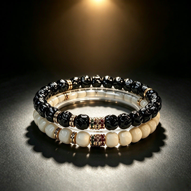Black and white bracelet styles stacked together on a display