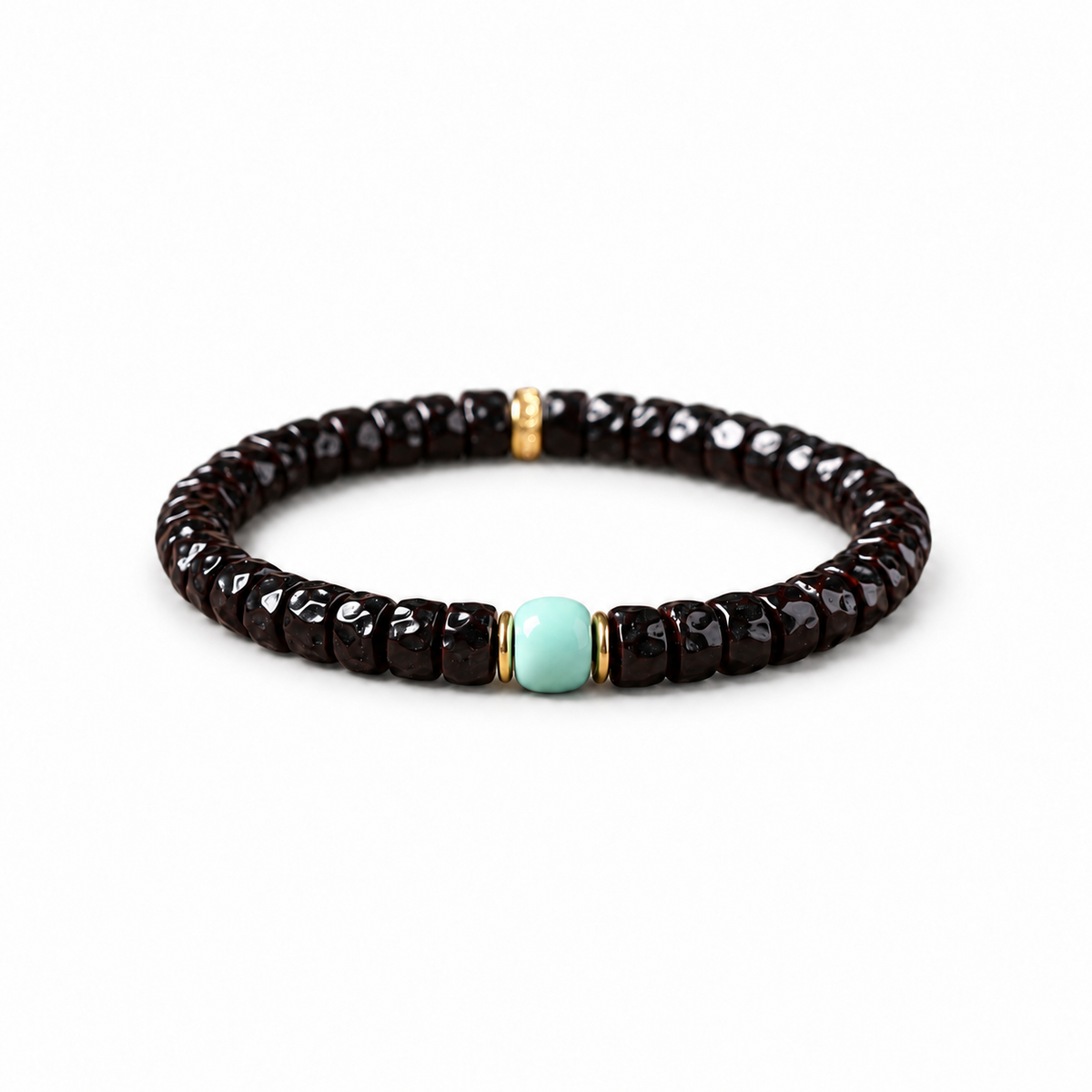 Sculpted dark coconut-pedicel bracelet with pale blue centerpiece on white