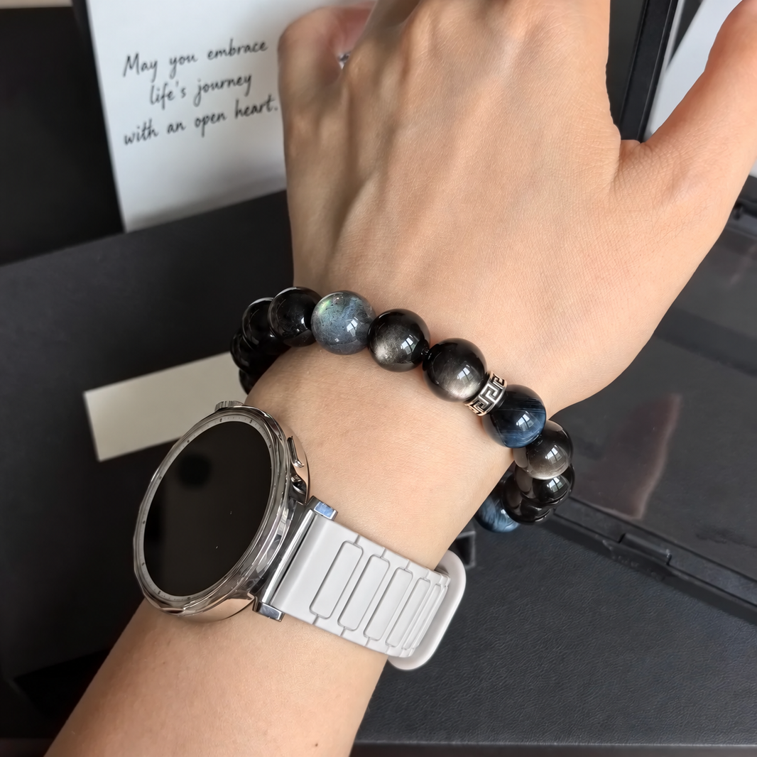 Blue tiger eye and silver sheen obsidian bracelet worn on wrist; watch not included