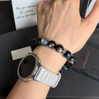 Blue tiger eye and silver sheen obsidian bracelet worn on wrist; watch not included