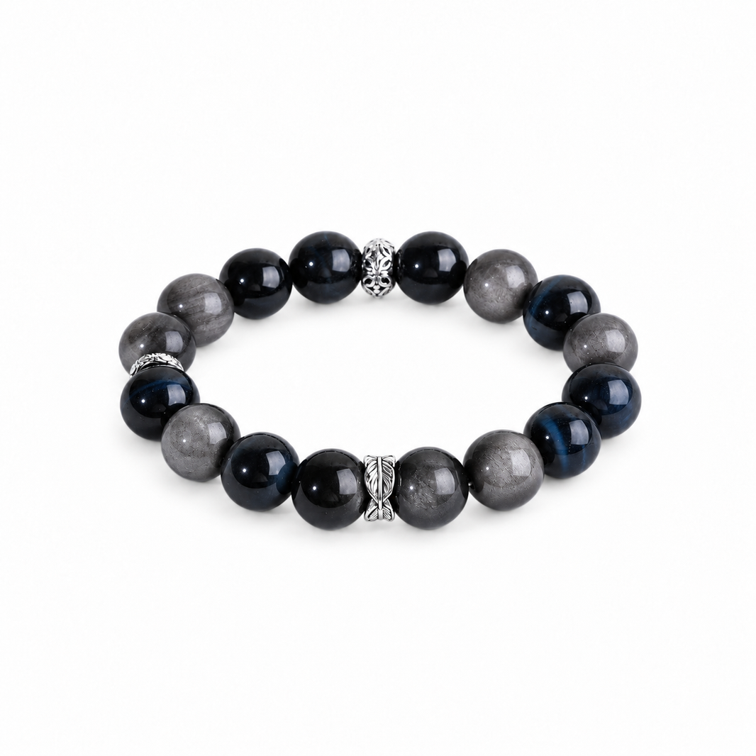 Blue tiger eye and silver-sheen obsidian bracelet with three patterned silver-tone spacers on white