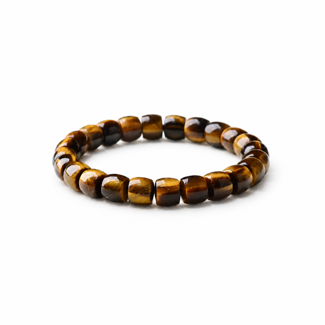 Golden tiger eye barrel-bead bracelet on a white background