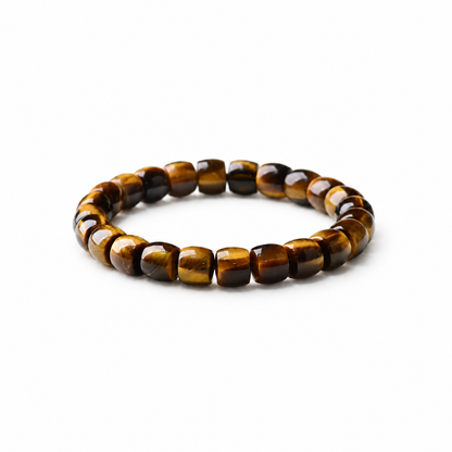 Golden tiger eye barrel-bead bracelet on a white background
