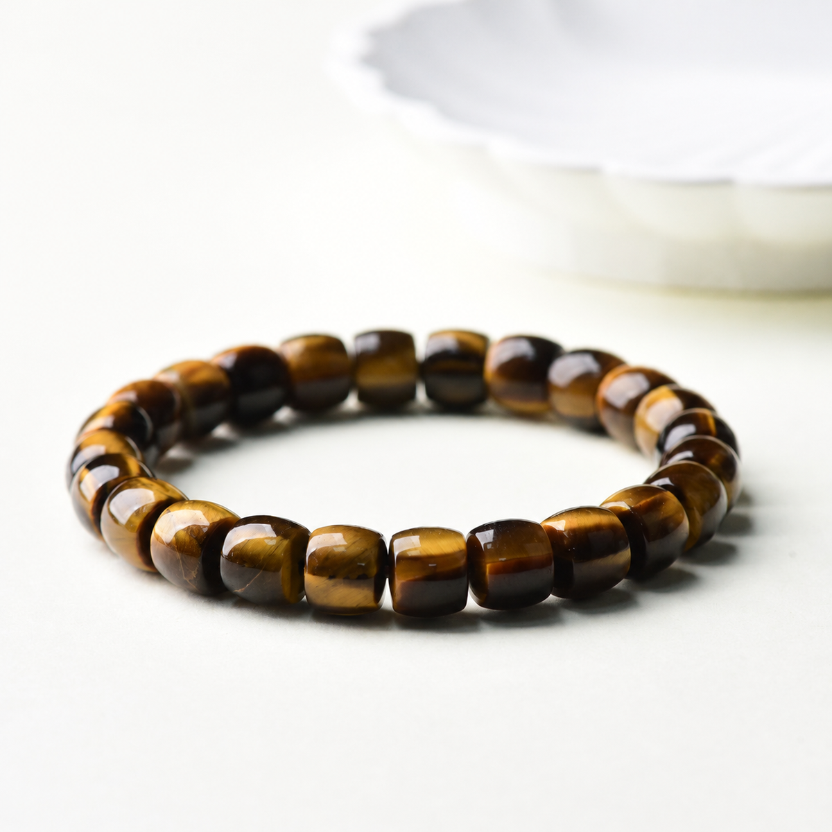 Low-angle view of golden tiger eye barrel-bead bracelet