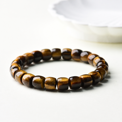 Low-angle view of golden tiger eye barrel-bead bracelet