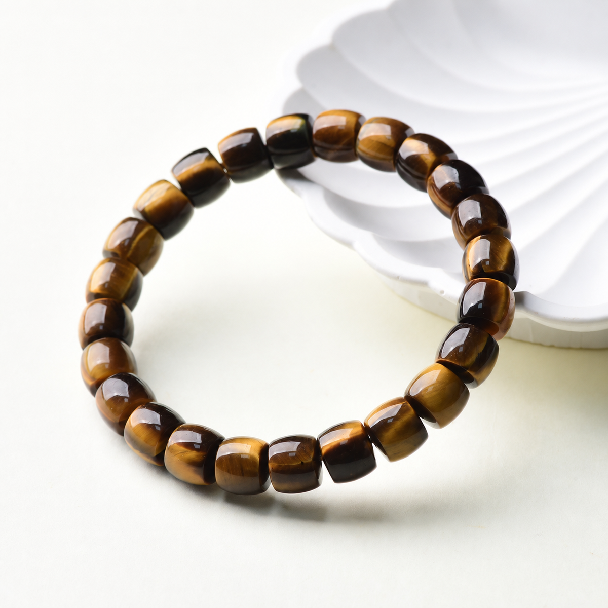 Angled detail of golden tiger eye barrel beads