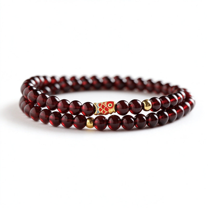 Double-wrap 4 mm garnet bracelet with koi fish and gold-tone spacers