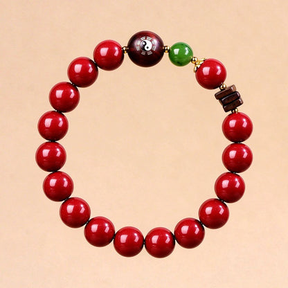 Complete red cinnabar bracelet with engraved bloodwood accent
