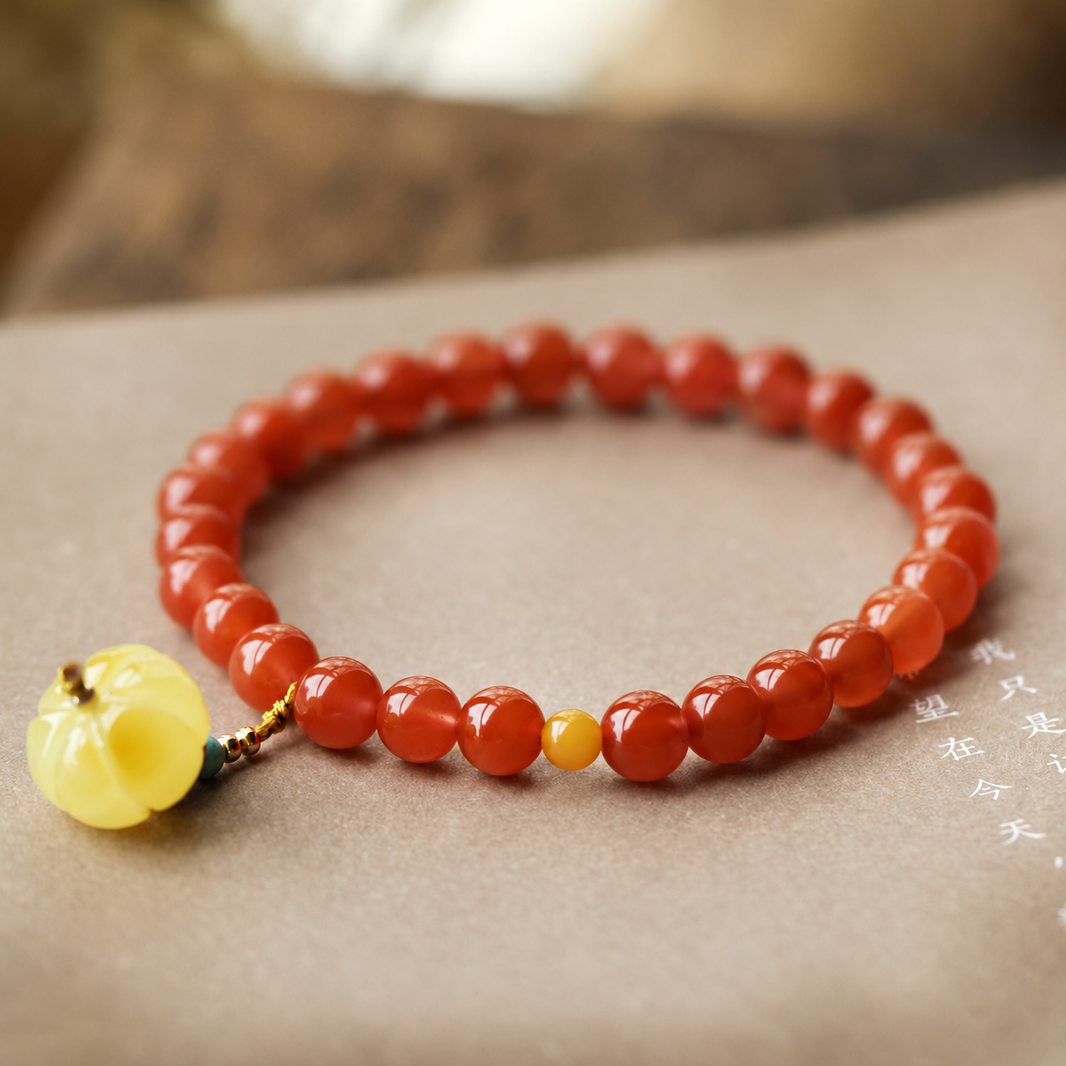 7.5 mm Nanhong red agate bracelet with amber pumpkin pendant