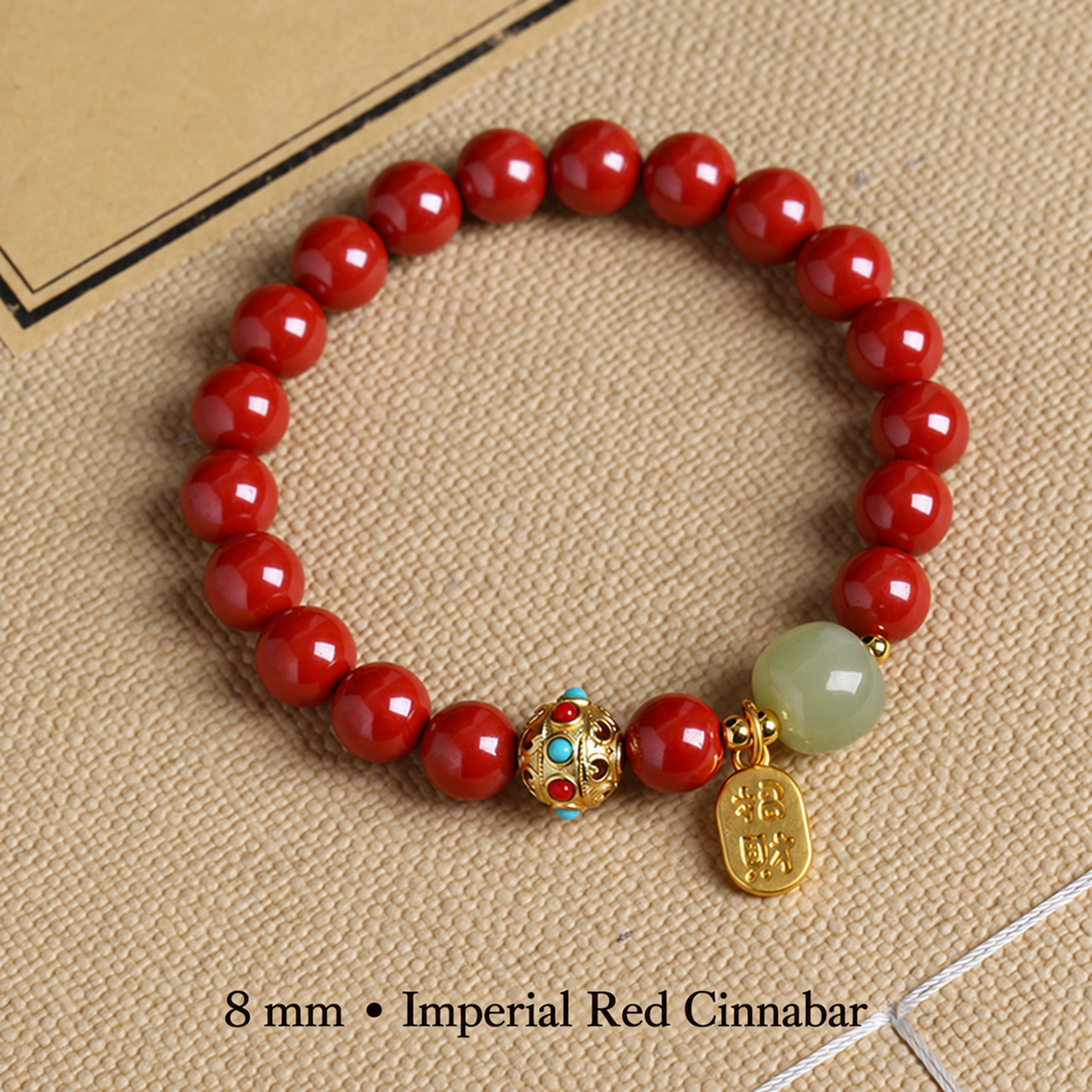 Imperial Red cinnabar bracelet with 8 mm red beads and gold-tone charm