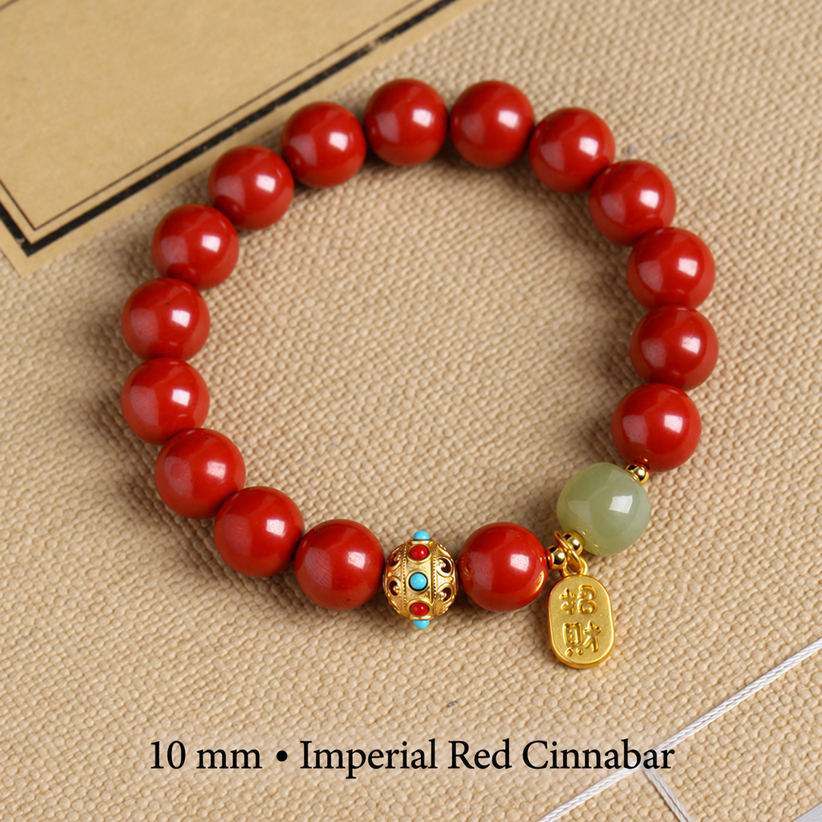 Imperial Red cinnabar bracelet with 10 mm red beads and gold-tone charm