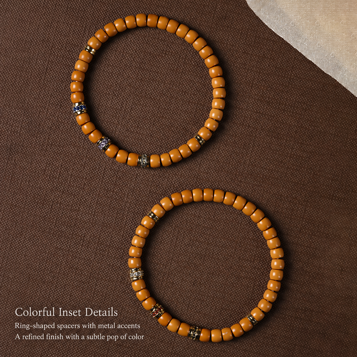 Two olive pit bracelets showing colorful decorative spacer details