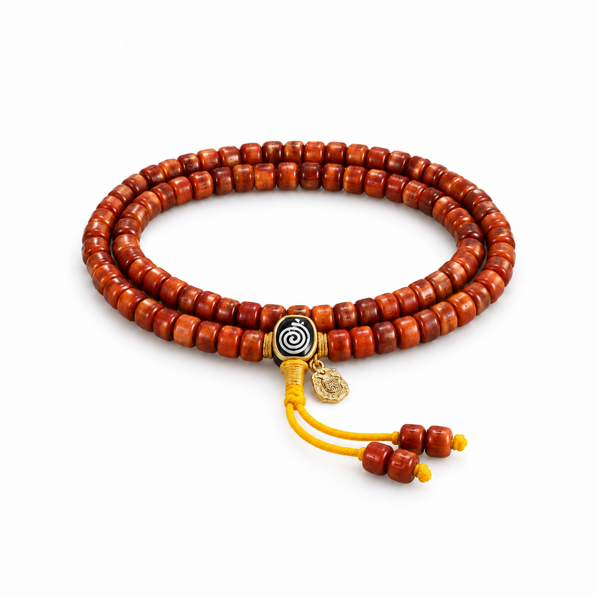 Tibetan-style reddish-brown bead mala with spiral accent and yellow cords on white