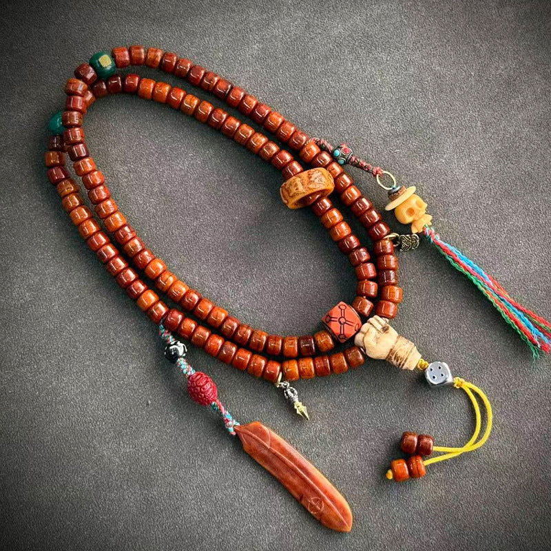 Tibetan-style yak bone mala, 05 - Skull & Long Red Charm