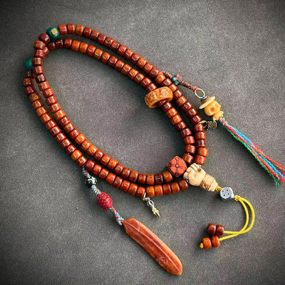 Tibetan-style yak bone mala, 05 - Skull & Long Red Charm