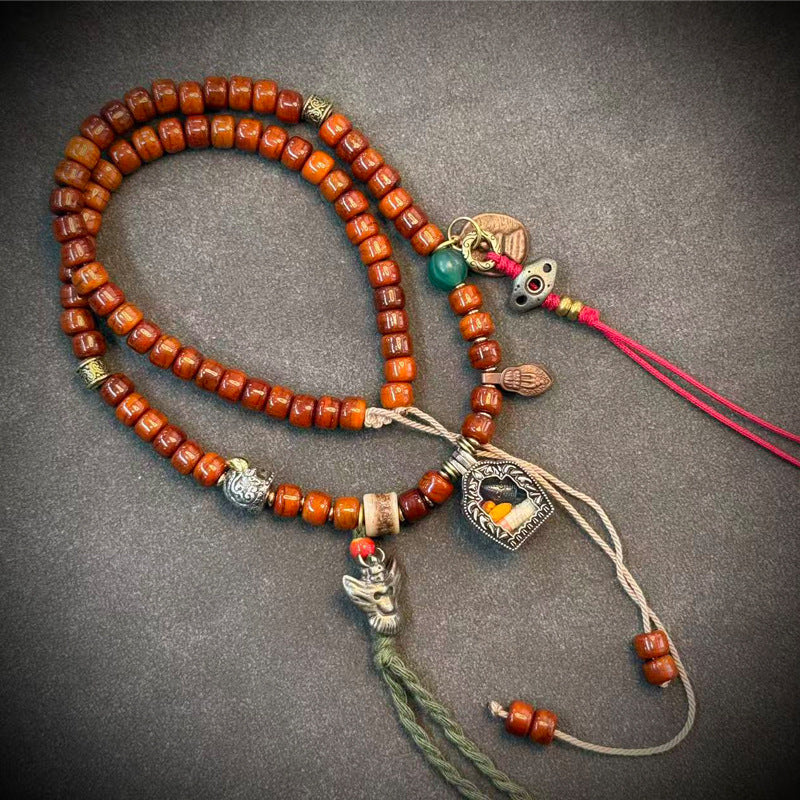 Tibetan-style yak bone mala, 09 - Shield & Green Tassel