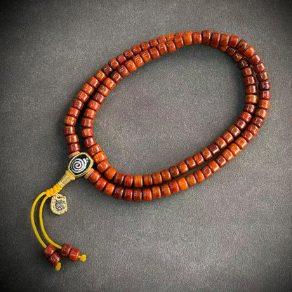 Tibetan-style yak bone mala, 12 - Spiral & Yellow Cord