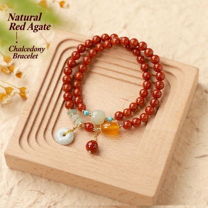 Natural red agate chalcedony bracelet displayed on a wooden tray