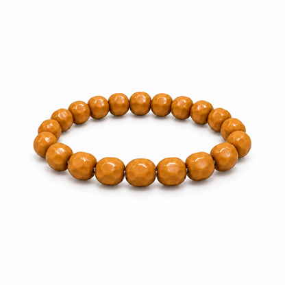 Cheese-cut walnut bead bracelet on a white background