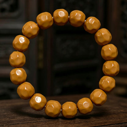 Polished walnut bracelet on a wooden surface