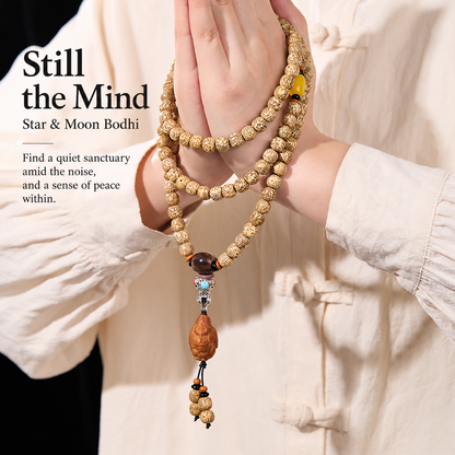 Golden Star and Moon Bodhi strand held in hands with English reflection text