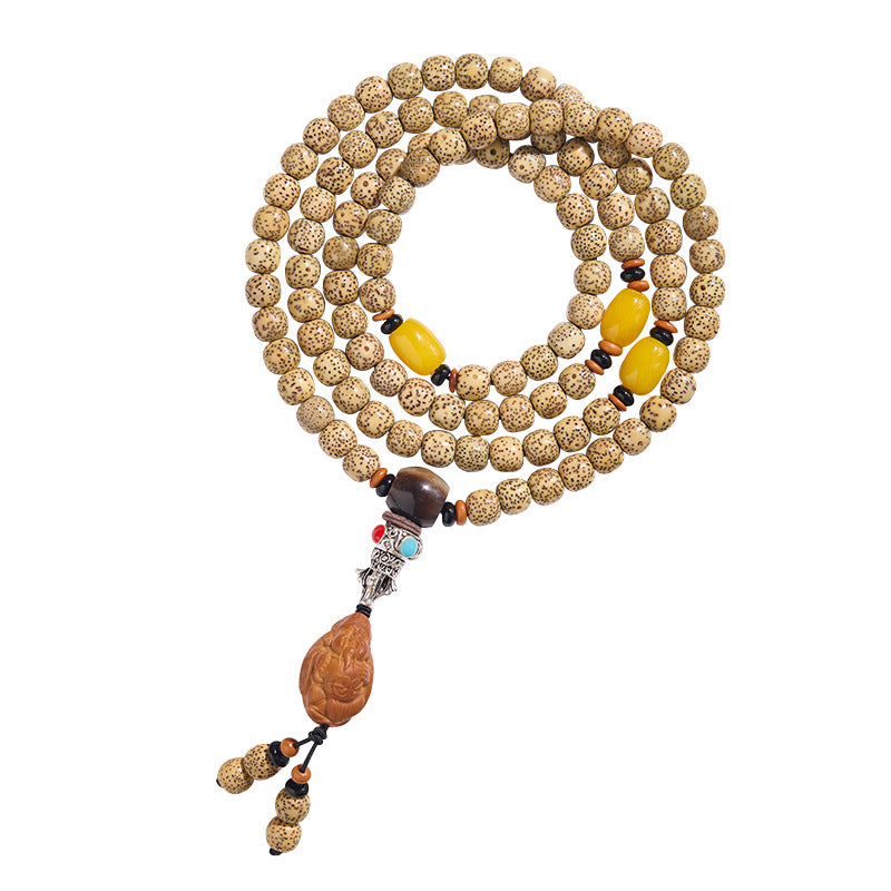 Complete golden Star and Moon Bodhi strand with yellow accents and carved pendant