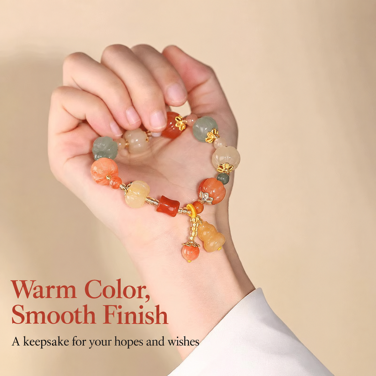 Multicolor pumpkin bead bracelet held in hand