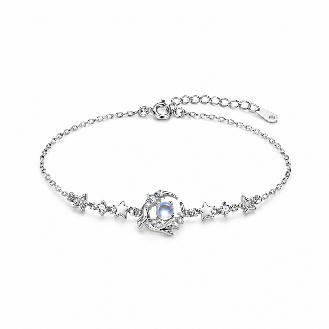 Sterling silver whale and star bracelet with blue glass center on white background