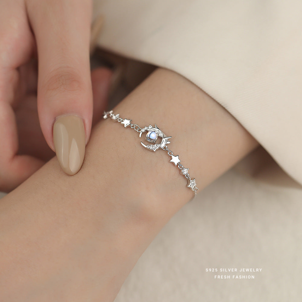 Whale and star silver bracelet worn on the wrist