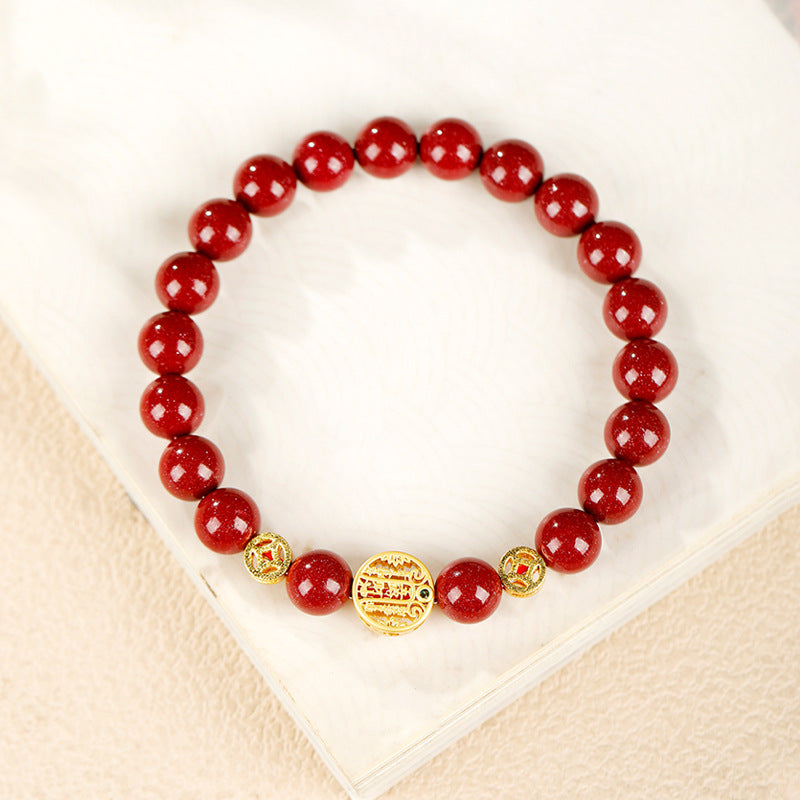 Original red cinnabar bracelet with gold-tone centerpiece and two openwork spacers