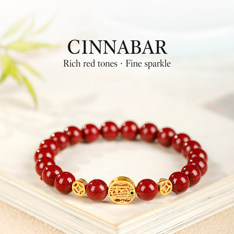 Red cinnabar bracelet with fine sparkle and gold-tone details
