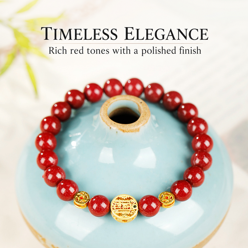 Red cinnabar bracelet displayed on a ceramic stand