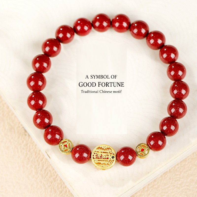 Red cinnabar bracelet with traditional good-fortune motif