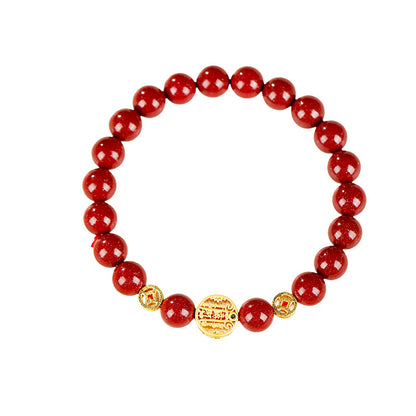 Original red cinnabar bracelet on white background