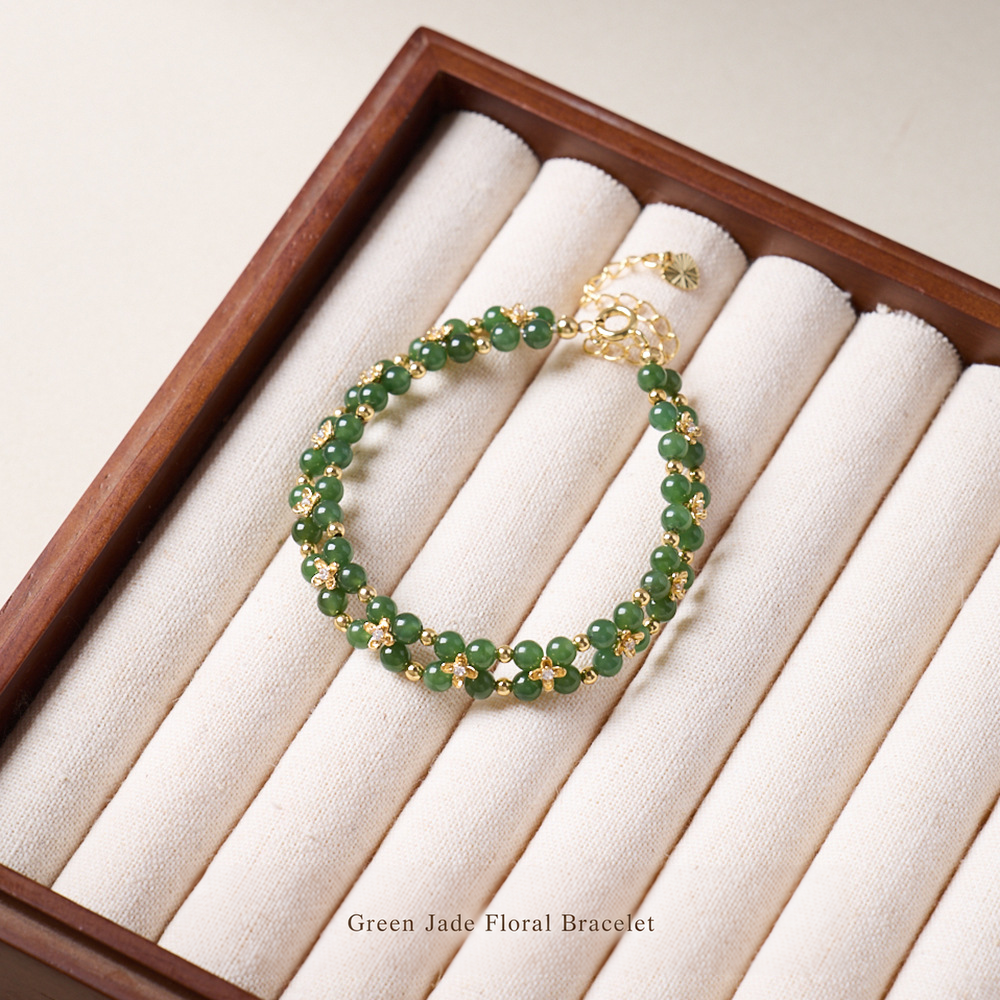 Green jade double-row floral bracelet on jewelry display