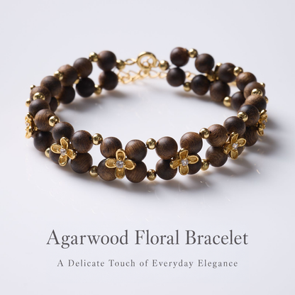 Close view of agarwood beads and four-petal flower details