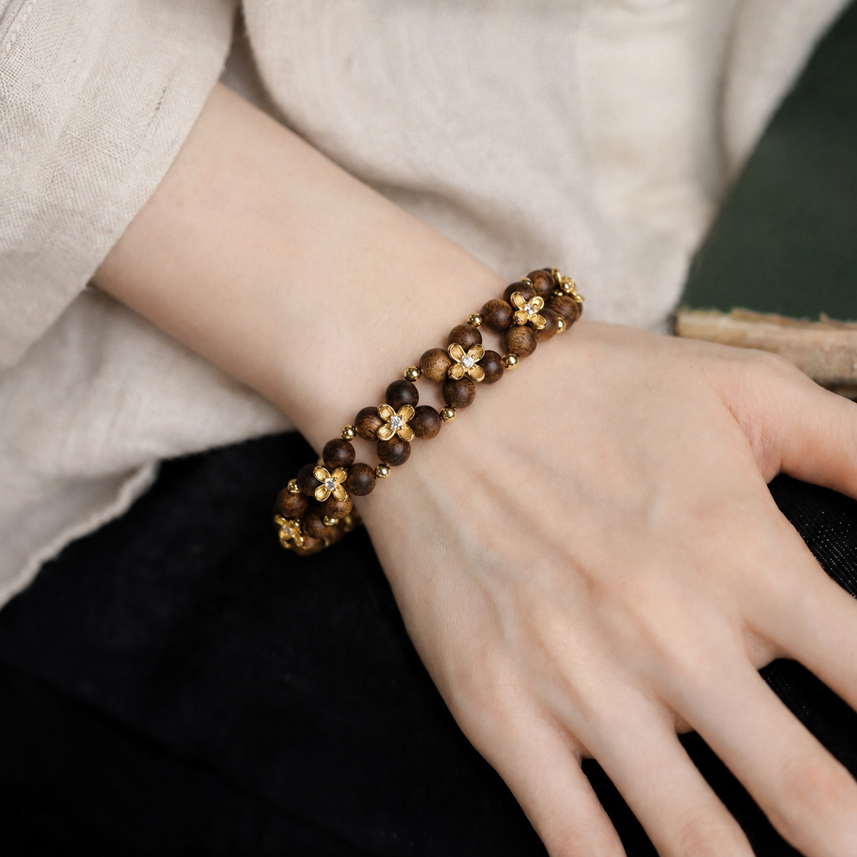 Agarwood floral bracelet worn on wrist