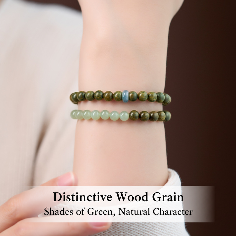 Green sandalwood and jade double-wrap bracelet worn on wrist