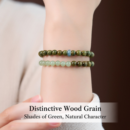 Green sandalwood and jade double-wrap bracelet worn on wrist