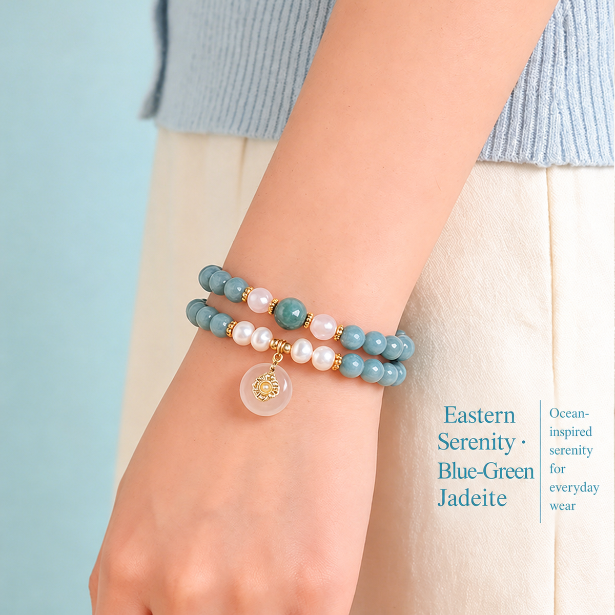 Blue-green jadeite and pearl double-wrap bracelet worn on a wrist