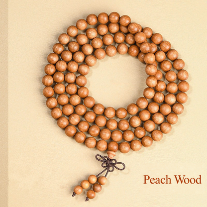 Peach wood bead strand with decorative cord knot