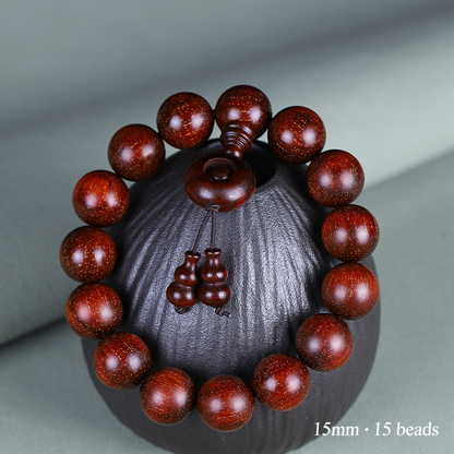 15mm red sandalwood bracelet with 15 beads and wooden ring detail