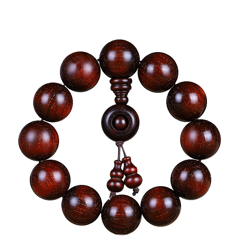 Original red sandalwood bracelet showing wooden ring and gourd-shaped drops