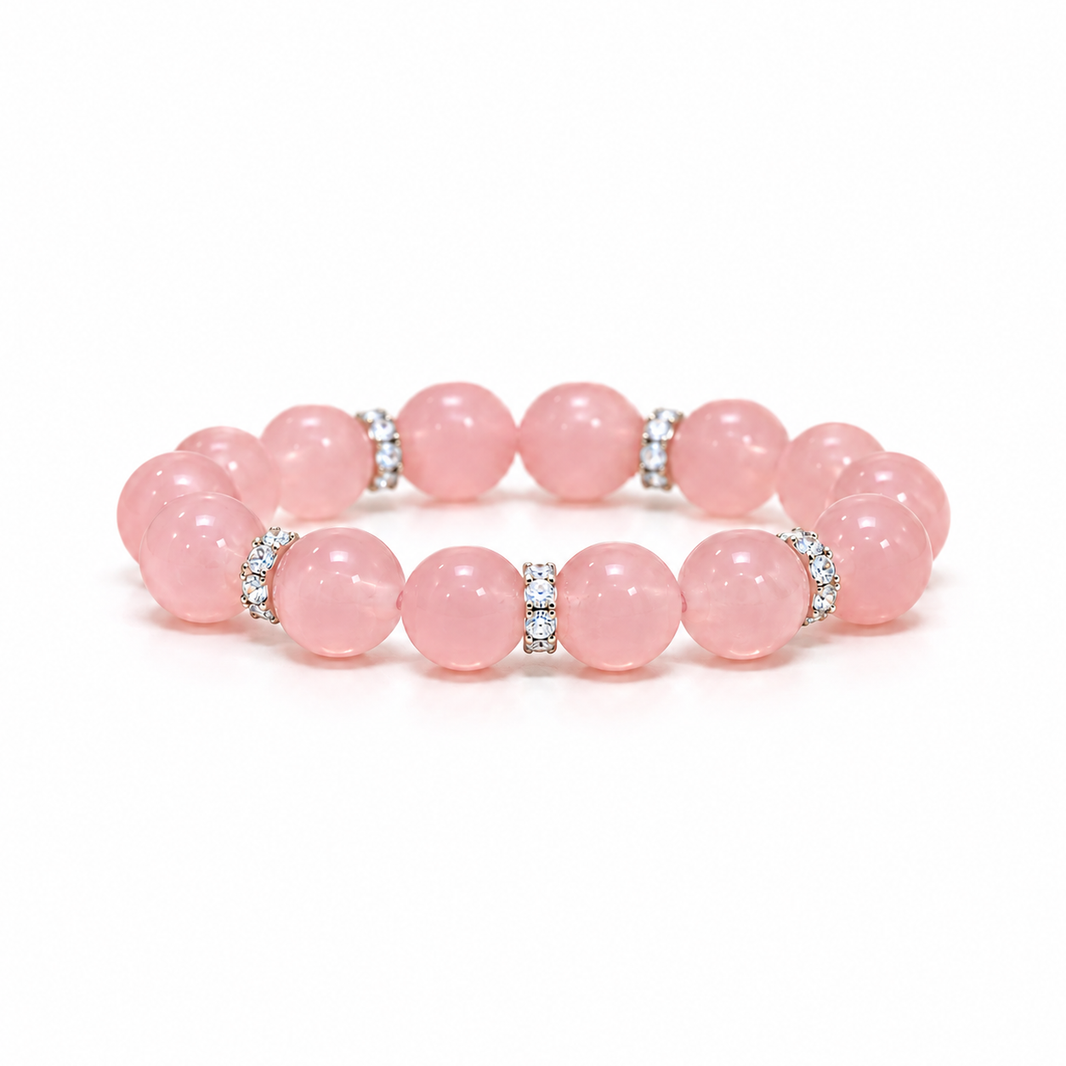 Low-angle white-background hero of the blush pink rose quartz bracelet