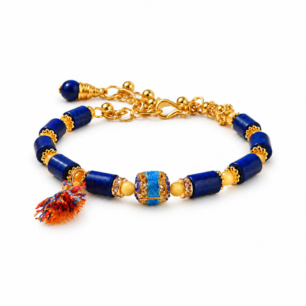 Blue and gold tassel bracelet on a pure white background